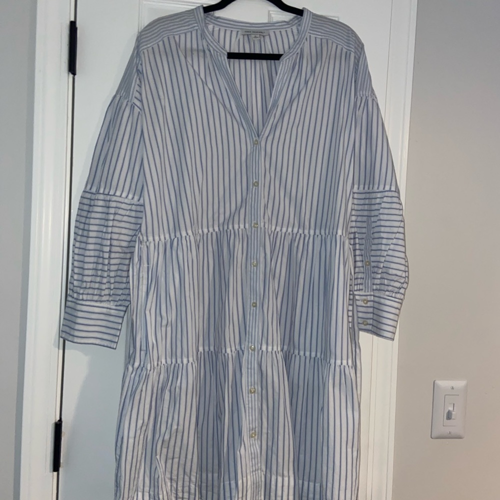 Long blue and white striped shirt with belt to match.